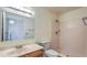 This bathroom boasts a full tub/shower, a built in vanity, and a large mirror to make the room feel more open at 6262 E Brown Rd # 65, Mesa, AZ 85205