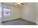 This bedroom includes a neutral carpet, a window for natural light and brightens the space at 6262 E Brown Rd # 65, Mesa, AZ 85205