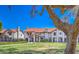 Scenic view of the condo complex with well-manicured lawns and mature trees, creating a peaceful environment at 6262 E Brown Rd # 65, Mesa, AZ 85205