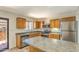 Functional kitchen with stainless steel appliances, island, and ample counter space, ready for culinary adventures at 6262 E Brown Rd # 65, Mesa, AZ 85205