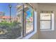 This window view features a communal pool, and green landscape bringing the outdoors inside to brighten the interior space at 6262 E Brown Rd # 65, Mesa, AZ 85205