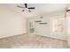 A spacious bedroom with neutral carpet, a ceiling fan and small display shelves on the wall at 6313 E Aire Libre Ln, Scottsdale, AZ 85254