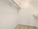 A simple but spacious walk-in closet with carpet flooring at 6313 E Aire Libre Ln, Scottsdale, AZ 85254