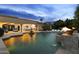Luxurious backyard with a sparkling pool, water features, and a seamless transition to indoor living at 6852 E Fanfol Dr, Paradise Valley, AZ 85253