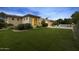 Lush backyard features a manicured lawn, a sparkling pool with a fountain, and a covered patio at 6852 E Fanfol Dr, Paradise Valley, AZ 85253