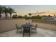 Charming balcony with wrought iron furniture offering a peaceful outdoor retreat and treetop views at 6852 E Fanfol Dr, Paradise Valley, AZ 85253