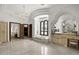 Expansive bathroom with a chandelier, soaking tub, and vanity area at 6852 E Fanfol Dr, Paradise Valley, AZ 85253