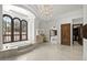 Luxurious bathroom with a soaking tub, arched windows, and elegant finishes at 6852 E Fanfol Dr, Paradise Valley, AZ 85253