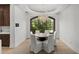 Elegant dining room boasting a chandelier, large window, and stylish seating at 6852 E Fanfol Dr, Paradise Valley, AZ 85253