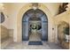 Grand entryway with a wrought iron door, tiled floor, and view of the staircase at 6852 E Fanfol Dr, Paradise Valley, AZ 85253