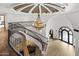 Elegant foyer featuring a curved staircase, chandelier, and view of the lower level at 6852 E Fanfol Dr, Paradise Valley, AZ 85253