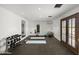 Spacious home gym equipped with weights, yoga mats, mirrors, and climate control at 6852 E Fanfol Dr, Paradise Valley, AZ 85253