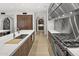 Gourmet kitchen featuring marble counters, custom wood cabinets, and professional-grade stainless steel appliances at 6852 E Fanfol Dr, Paradise Valley, AZ 85253