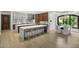 Spacious kitchen featuring a large marble island with bar seating, stainless appliances, and a bright breakfast nook at 6852 E Fanfol Dr, Paradise Valley, AZ 85253
