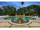Inviting pool with tiered fountain, surrounded by lush greenery and sun loungers for relaxation at 6852 E Fanfol Dr, Paradise Valley, AZ 85253