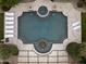 Aerial view of a luxurious pool with a spa, fountain, and lounge chairs at 6852 E Fanfol Dr, Paradise Valley, AZ 85253
