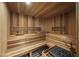 Home sauna features wood paneled interior, wooden bench seating, and integrated heating system at 6852 E Fanfol Dr, Paradise Valley, AZ 85253