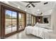 Relaxing spa room with massage tables, mirrored wall, and access to an outdoor patio at 6852 E Fanfol Dr, Paradise Valley, AZ 85253