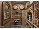 Custom wine cellar featuring wood racking, decorative lighting, and temperature control system at 6852 E Fanfol Dr, Paradise Valley, AZ 85253
