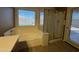 Bright bathroom features a garden tub, and separate glass enclosed shower at 703 E Taylor Trl, San Tan Valley, AZ 85143