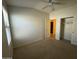 Neutral bedroom featuring a closet and a view of another room, creating a comfortable and inviting space at 703 E Taylor Trl, San Tan Valley, AZ 85143