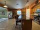 Eat-in kitchen with a center island, stainless steel appliances, and a tile backsplash at 703 E Taylor Trl, San Tan Valley, AZ 85143