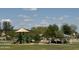 Community playground with colorful play structures, shaded picnic areas, and landscaped surroundings at 703 E Taylor Trl, San Tan Valley, AZ 85143