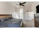Spacious bedroom with neutral tones, a cozy bed, and plenty of natural light at 7326 W Pershing Ave, Peoria, AZ 85381