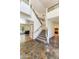 Spacious foyer featuring decorative tile flooring, staircase, and views into multiple rooms at 7326 W Pershing Ave, Peoria, AZ 85381