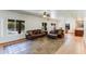 Bright living room with comfortable seating, views of the backyard pool, and easy access to adjacent rooms at 7326 W Pershing Ave, Peoria, AZ 85381