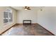 Bright living room with decorative tile flooring, white walls, a ceiling fan, and natural light at 7326 W Pershing Ave, Peoria, AZ 85381