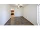 Bright living room with decorative tile flooring, white walls, and a ceiling fan at 7326 W Pershing Ave, Peoria, AZ 85381