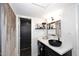 Bathroom featuring black sink and cabinet, white countertop and modern decor at 7350 N Via Paseo Del Sur -- # Q105, Scottsdale, AZ 85258