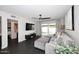Bright living room features stylish gray sofa, dark floors, and sliding glass doors to enhance natural light at 7350 N Via Paseo Del Sur -- # Q105, Scottsdale, AZ 85258