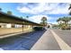 Convenient covered parking area with clearly marked spaces and lush palm trees in a well-maintained community at 7350 N Via Paseo Del Sur -- # Q105, Scottsdale, AZ 85258