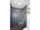 Modern shower with gray tile, glass door and gray tile floors at 7350 N Via Paseo Del Sur -- # Q105, Scottsdale, AZ 85258