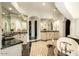 Elegant bathroom featuring dual vanities, a soaking tub, and stylish tile flooring at 7801 N Saguaro Dr, Paradise Valley, AZ 85253