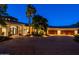 Home exterior featuring a spacious driveway, palm trees, and three-car garage at 7801 N Saguaro Dr, Paradise Valley, AZ 85253