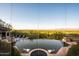 Relaxing infinity pool with scenic views and lush landscape and outdoor lounge furniture at 7801 N Saguaro Dr, Paradise Valley, AZ 85253