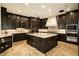Gourmet kitchen features a large center island, custom cabinetry, and stainless steel appliances at 7801 N Saguaro Dr, Paradise Valley, AZ 85253