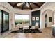 Bright living area featuring high ceilings, fireplace, comfortable seating, and a picturesque view at 7801 N Saguaro Dr, Paradise Valley, AZ 85253