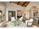Bright and airy living room featuring high ceilings, elegant furnishings, and seamless flow into the dining area at 7801 N Saguaro Dr, Paradise Valley, AZ 85253