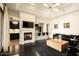 Bright living room with fireplace, modern furnishings, and seamless transition to the kitchen at 7801 N Saguaro Dr, Paradise Valley, AZ 85253
