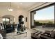 Open-concept living room featuring a seamless indoor-outdoor flow and stunning views of the surrounding landscape at 7801 N Saguaro Dr, Paradise Valley, AZ 85253