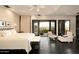 Serene primary suite featuring hardwood floors, a sitting area, and access to a private outdoor space at 7801 N Saguaro Dr, Paradise Valley, AZ 85253