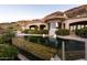 Stunning pool with integrated spa, stone accents, and panoramic views of the surrounding mountains at 7801 N Saguaro Dr, Paradise Valley, AZ 85253