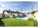 Expansive backyard with pool, putting green and outdoor kitchen at 8132 E Valley View Rd, Scottsdale, AZ 85250