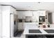 Stylish kitchen featuring stainless steel appliances and a large island at 8132 E Valley View Rd, Scottsdale, AZ 85250