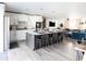 Spacious kitchen with island, seamlessly flowing into the dining and living areas at 8132 E Valley View Rd, Scottsdale, AZ 85250