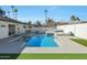 Inviting backyard pool with lounge area, landscaping, and stylish modern design, perfect for entertaining at 8132 E Valley View Rd, Scottsdale, AZ 85250